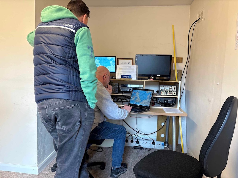 Group members operating amateur radio equipment